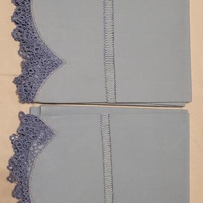 Lot 132: Vintage Handmade Crochet Edge Blue Pillowcases, Eggshell Pillowcases (was tape residue) and (2) White Full Flat Sheet