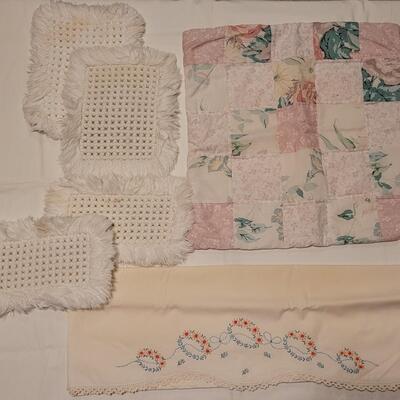 Lot 137: Mixed Linens - Cross Stitched Pillowcase (1), White Macrame Pieces (4) and Quilted Pillowcase (1)