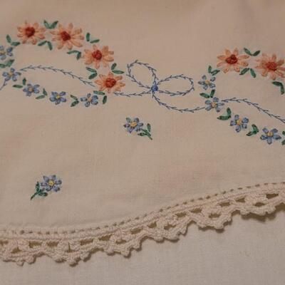 Lot 137: Mixed Linens - Cross Stitched Pillowcase (1), White Macrame Pieces (4) and Quilted Pillowcase (1)