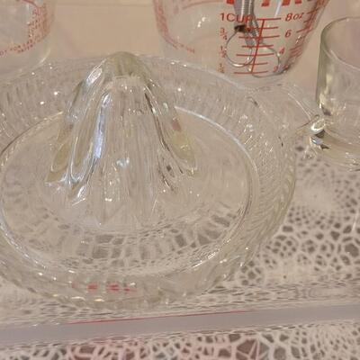 Lot 178: Contemporary Rossville, Ohio Pie Plate, Glass Juicer, Measuring Cups, Kitchen Utensils and Vintage Cookie Cutters