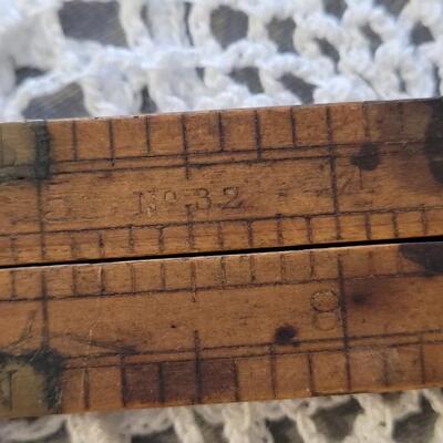 Lot 182: Antique Wood Pointer, Multi Fold Ruler and Sliding Ruler
