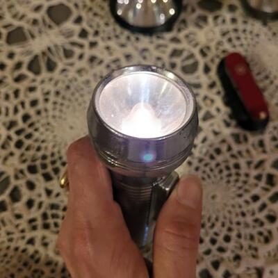 Lot 186: Vintage Flashlights, Bungee Tie Downs  and small Swiss Army Knife