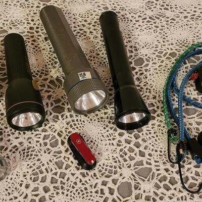 Lot 186: Vintage Flashlights, Bungee Tie Downs  and small Swiss Army Knife