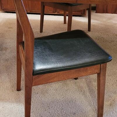 Lot 203: Mid Century Modern FOUNDERS American Walnut Dining Table with 2 Leaves and 4 Black Leather Seat Cane Back Chairs