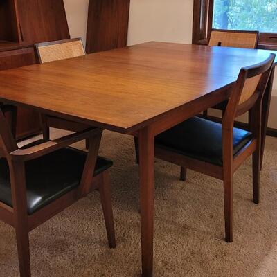 Lot 203: Mid Century Modern FOUNDERS American Walnut Dining Table with 2 Leaves and 4 Black Leather Seat Cane Back Chairs