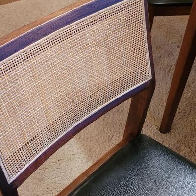 Lot 203: Mid Century Modern FOUNDERS American Walnut Dining Table with 2 Leaves and 4 Black Leather Seat Cane Back Chairs