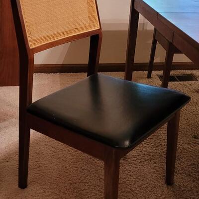 Lot 203: Mid Century Modern FOUNDERS American Walnut Dining Table with 2 Leaves and 4 Black Leather Seat Cane Back Chairs