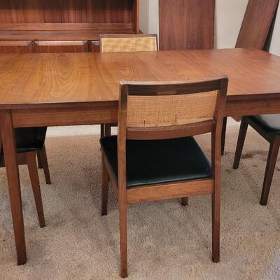Lot 203: Mid Century Modern FOUNDERS American Walnut Dining Table with 2 Leaves and 4 Black Leather Seat Cane Back Chairs