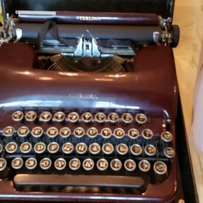 Burgundy or maroon  color Smith Corona manual portable typewriter