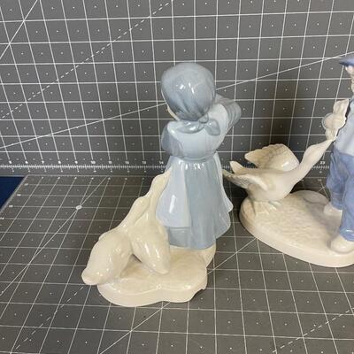 Porcelain Statue Boy and a Girl 