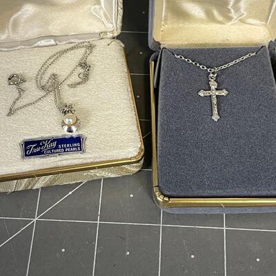 2 Necklaces - 1 cross and 1 pearl 