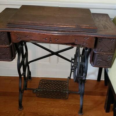Antique sewing machine cabinet with machine