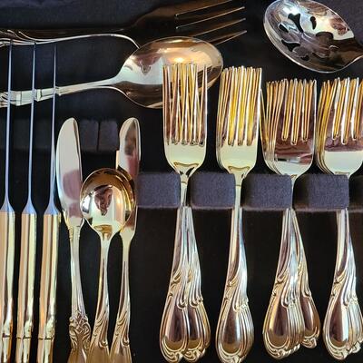 Lot 312: Gold Tone International Flatware Setting for 12