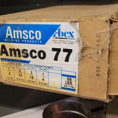 Lot 25: Unused Sealed 50lb. Box of AMSCO 77 Welding Rods
