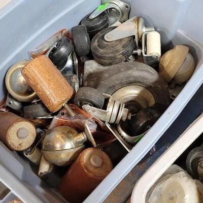 Lot 58: (2) Small Tote Containers w/ Lids full of Caster Wheels
