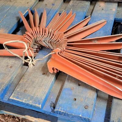 Lot 59: Vintage Orange Metal Farm Garden Stakes