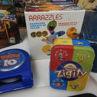 8 Puzzles and Games, Trivial Pursuit, Arrazzles, Zigity, An Evening of Murder