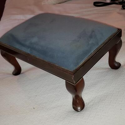 Stool with bluish gray fabric