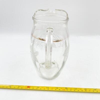 VINTAGE 8â€ GLASS PITCHER W/ GRAPEVINE DETAIL
