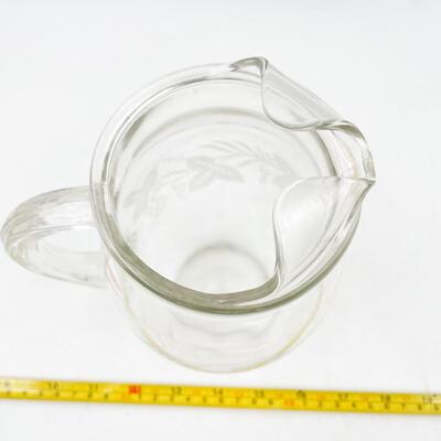 VINTAGE 8â€ GLASS PITCHER W/ GRAPEVINE DETAIL