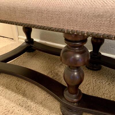 Upholstered bench with nailhead trim