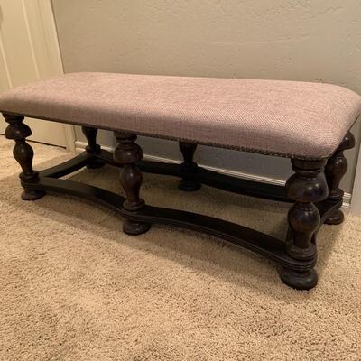 Upholstered bench with nailhead trim