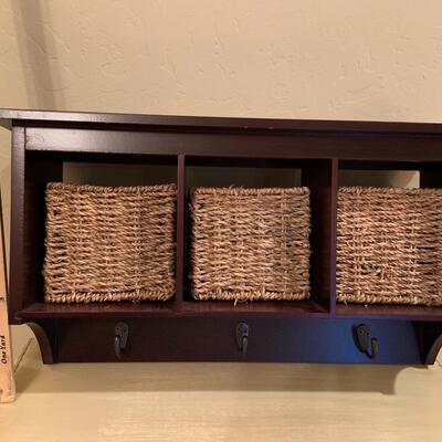 Wall storage with seagrass baskets and hooks