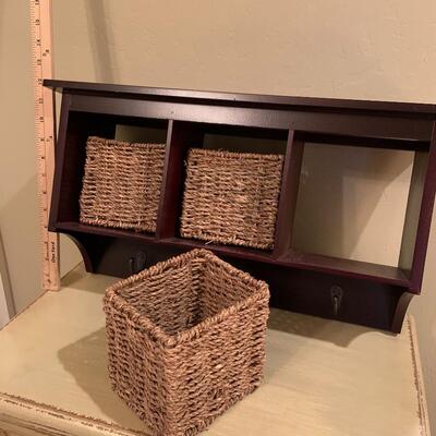 Wall storage with seagrass baskets and hooks