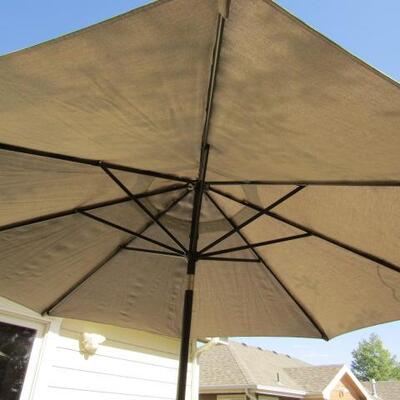 LOT 8  IRON PATIO TABLE WITH 4 CHAIRS AND A HUGE UMBRELLA