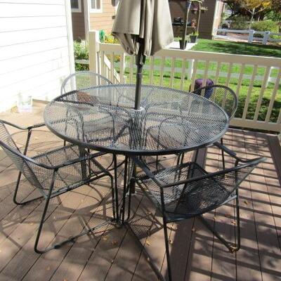 LOT 8  IRON PATIO TABLE WITH 4 CHAIRS AND A HUGE UMBRELLA