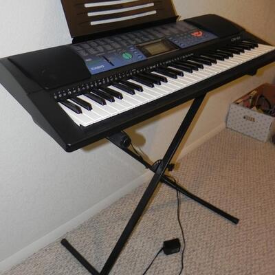 LOT 37  CASIO  ELECTRIC KEYBOARD AND STAND