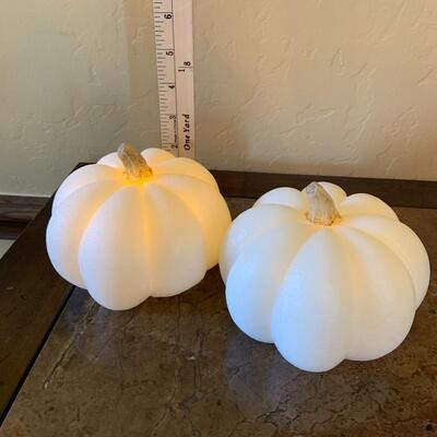 Light up wax pumpkins.
