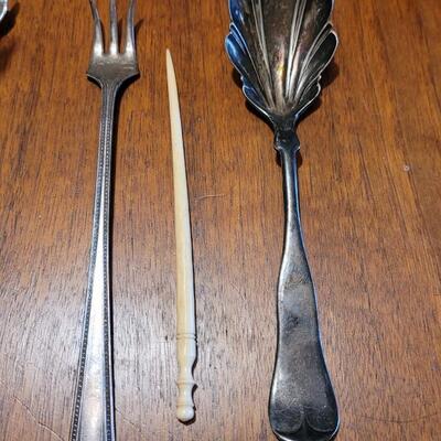 Lot 98: Vintage Cut Crystal Flower Salt & Pepper  2 Sets, Curvee Silver Spreader, Sugar Tongs, Berry Spoon, Oyster Fork and Pick
