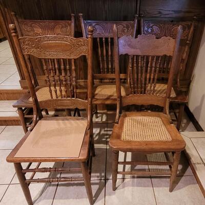 Lot 109: (5) Antique Oak Chairs (4 Cane Seat and one need Repair and comes with Seat Material