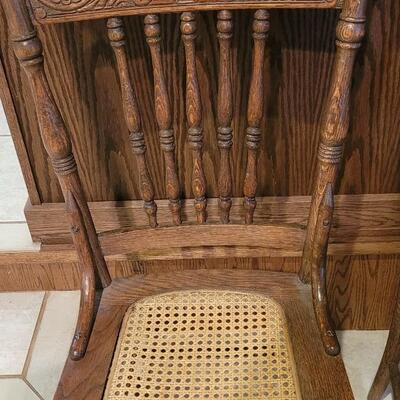 Lot 109: (5) Antique Oak Chairs (4 Cane Seat and one need Repair and comes with Seat Material
