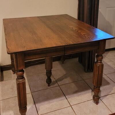 Lot 110: Antique 5 Leg Oak Table with 3 Leaves and Storage Box