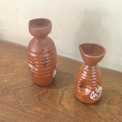 Two Saki pitchers different sizes