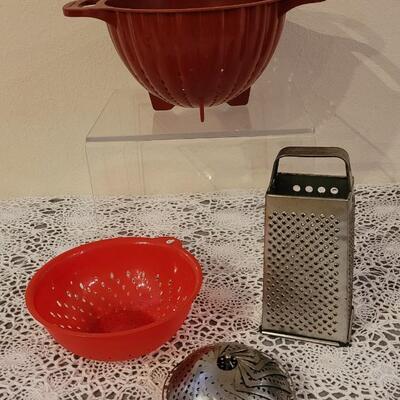 Lot 127: (2) Colanders. Steam Basket and Grater