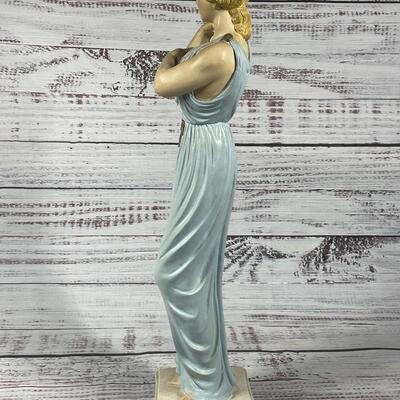 Antique Statue of a Woman in a Light Blue Toga