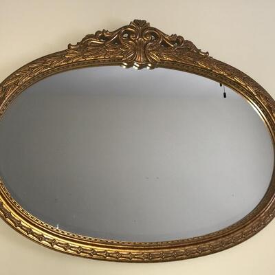 Gilded oval mirror