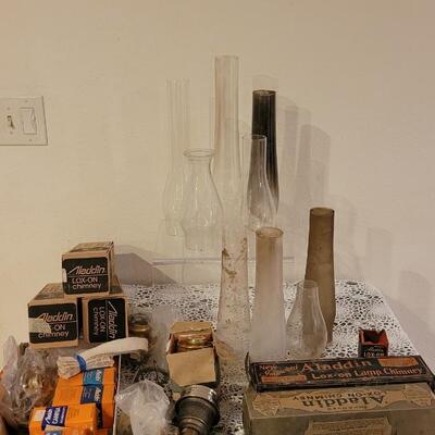 Lot 273: Large Lot of Kerosene Lamp Chimneys, Wicks and Other Parts
