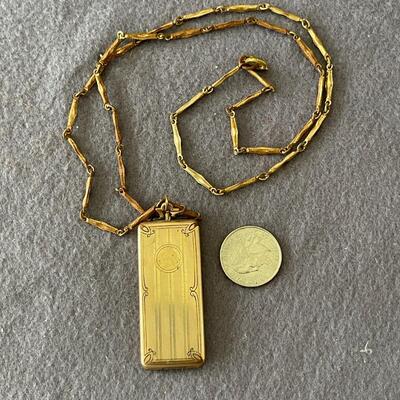 AAJ20    ANTIQUE LOCKET HOLDS WHATEVER? 1920s