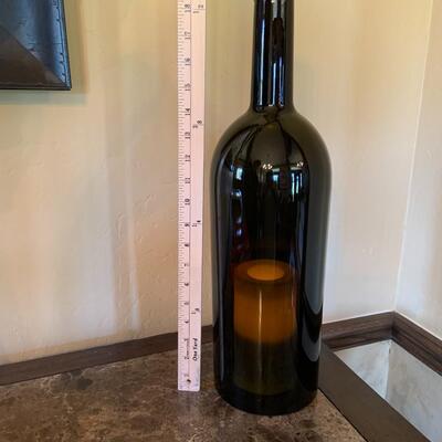 Large wine bottle with candle