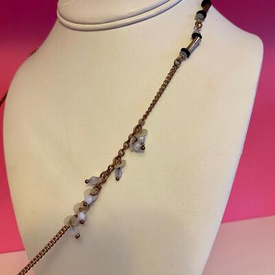 Long Necklace with Beads and Black Pom Pots