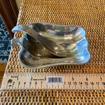 Silver pepper dish with spoon