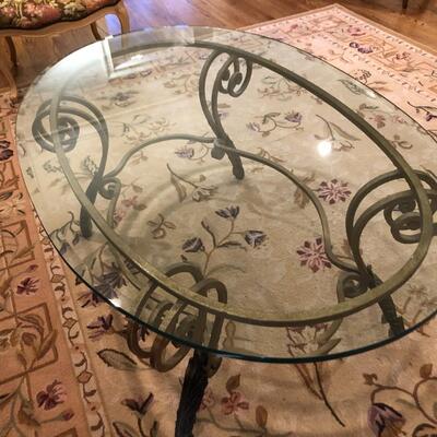 Wrought Iron Coffee Table with Oval Glass Top - Item Must be Scheduled for Pickup.