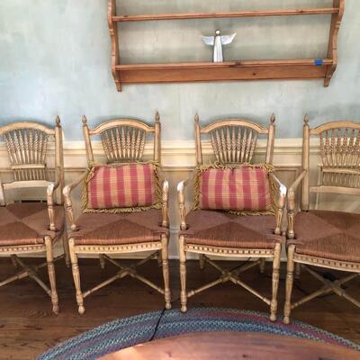 Set of 4 Dining Chairs with Arms and wicker based seats plus 2 pillows - Item Must be Scheduled for Pickup.