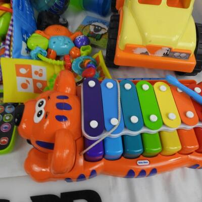 Kid Toy Lot: Dog Xylophone, Dump Truck, Trains, Books, Baby Toys