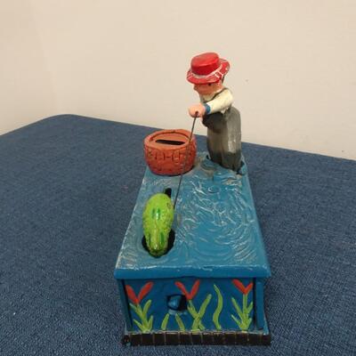 LOT 104.  VINTAGE DIE CAST FISHING METAL BANK