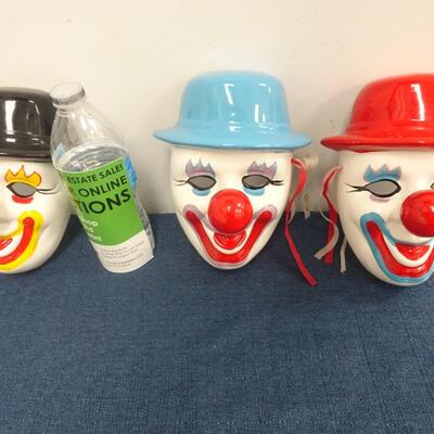 LOT 129. THREE DECORATIVE CLOWN MASK